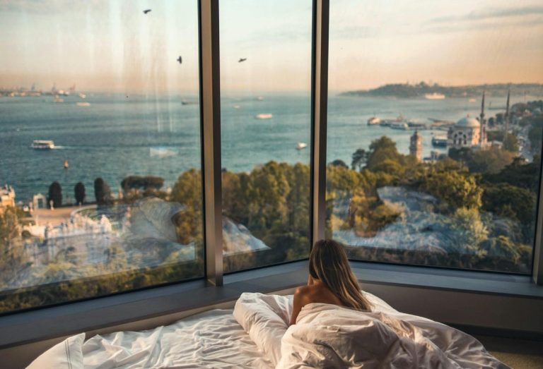 girl-in-bed-with-beautiful-view